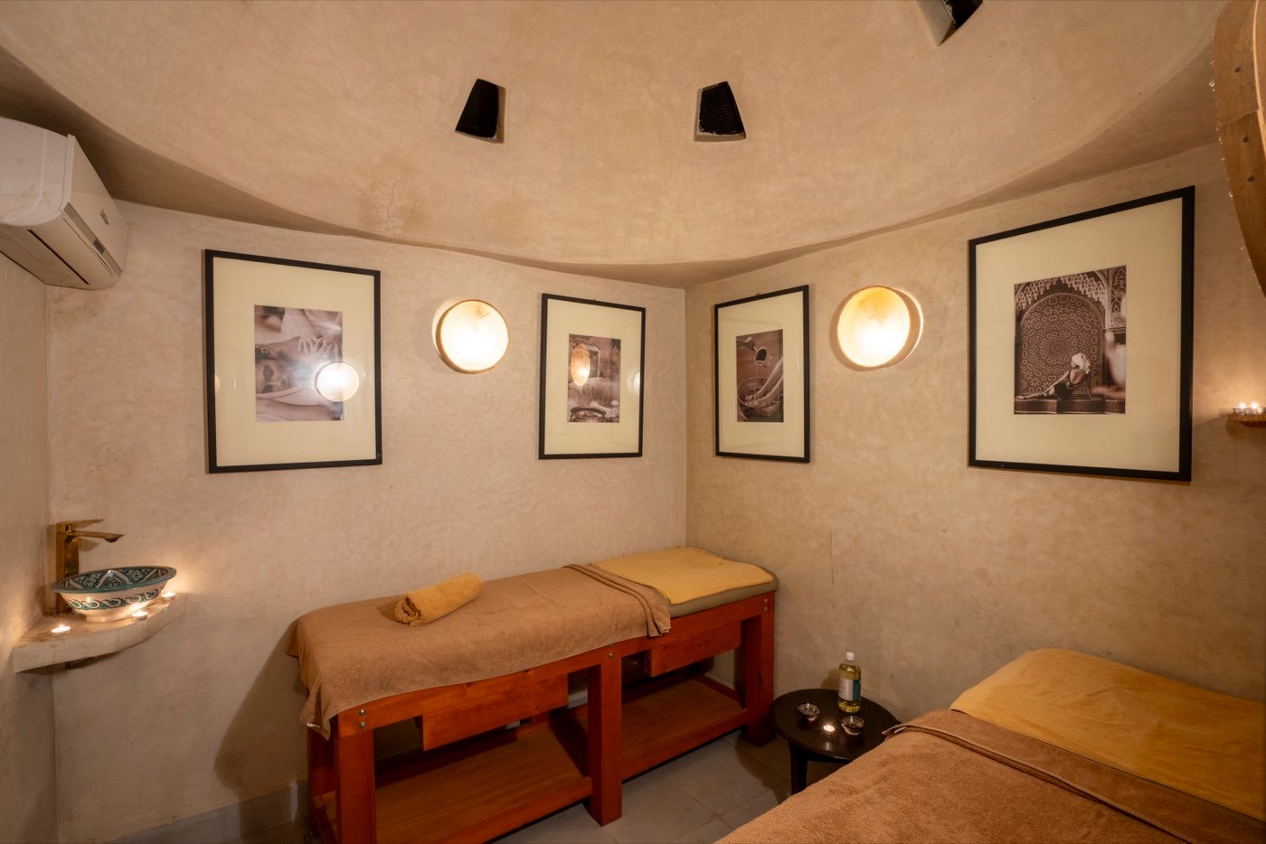 The treatment room, two massage tables under a domed ceiling pierced with star-shaped skylights